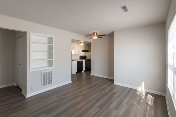 This is a photo of the living room and kitchen in an upgraded 500 square foot 1 bedroom, 1 bath Cedar floor plan at Montana Valley Apartments in Cincinnati, OH.