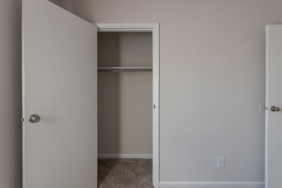 This is a photo of the bedroom closet in an upgraded 500 square foot 1 bedroom, 1 bath Cedar floor plan at Montana Valley Apartments in Cincinnati, OH.