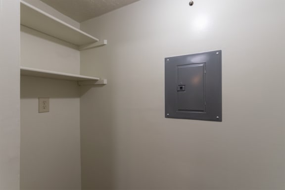 This is a photo of the utility room with full-sized washer dryer connections of the 716 square foot 1 bedroom, 1 bath Cypress floor plan at Montana Valley Apartments in Cincinnati, OH.