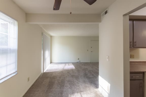 This is a photo of the living room from the dining area of the 836 square foot 2 bedroom, 1 bath Hickory floor plan at Montana Valley Apartments in Cincinnati, OH.