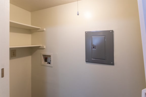 This is a photo of the utility closet with full-size washer and dryer connections of the 836 square foot 2 bedroom, 1 bath Hickory floor plan at Montana Valley Apartments in Cincinnati, OH.