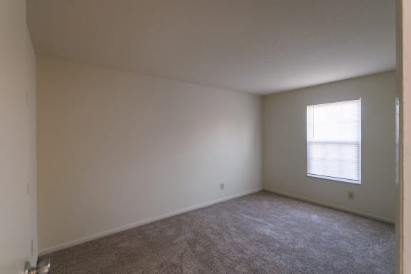 This is a photo of the primary bedroom of the 836 square foot 2 bedroom, 1 bath Hickory floor plan at Montana Valley Apartments in Cincinnati, OH.