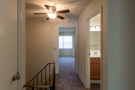 This is a photo of the upstairs hallway of the 1310 square foot 3 bedroom, 1.5 bath Pine floor plan at Montana Valley Apartments in Cincinnati, OH.
