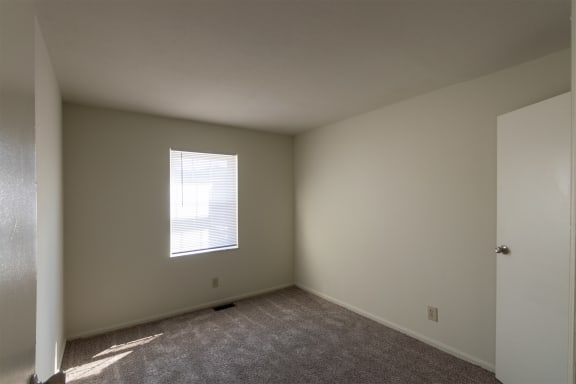 This is a photo of one of the 2 9.5 feet by 10 feet 2 inch (right) bedrooms of the 1310 square foot 3 bedroom, 1.5 bath Pine floor plan at Montana Valley Apartments in Cincinnati, OH.