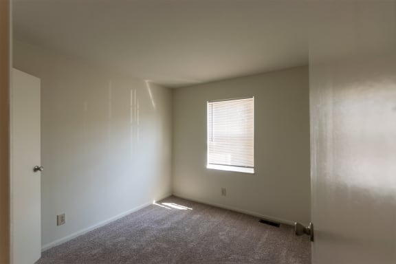 This is a photo of one of the 2 9.5 feet by 10 feet 2 inch (left) bedrooms of the 1310 square foot 3 bedroom, 1.5 bath Pine floor plan at Montana Valley Apartments in Cincinnati, OH.