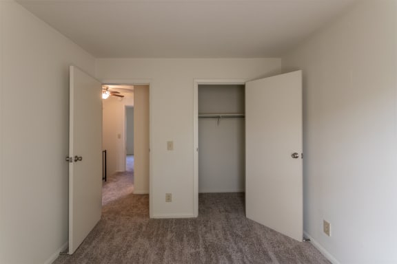 This is a photo of one of the 2 9.5 feet by 10 feet 2 inch (left) bedrooms of the 1310 square foot 3 bedroom, 1.5 bath Pine floor plan at Montana Valley Apartments in Cincinnati, OH.