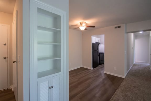 This is a photo the built-in bookshelf and dining area of an upgraded 1030 square foot, Oak 2 bedroom, 1 bath apartment at Montana Valley Apartments in the Westwood neighborhood of Cincinnati, OH.
