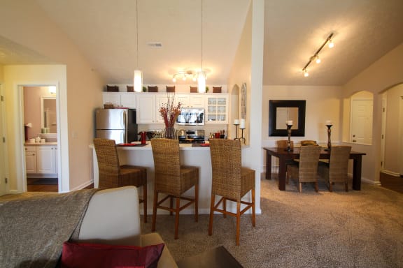 This is a photo of the kitchen and dining room in the 1242 square foot, 2 bedroom Atlantic floor plan at Nantucket Apartments in Loveland, OH.