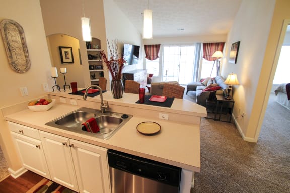 This is a photo of the kitchen/living room in the 2 bedroom Atlantic floor plan at Nantucket Apartments in Loveland, OH.