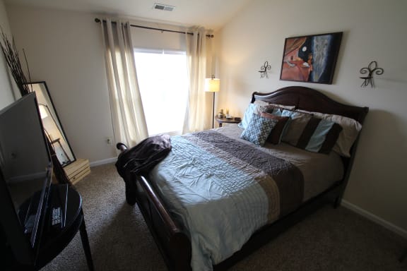 This is a photo of the bedroom in the 1 bedroom Clipper floor plan at Nantucket Apartments in Loveland, OH.