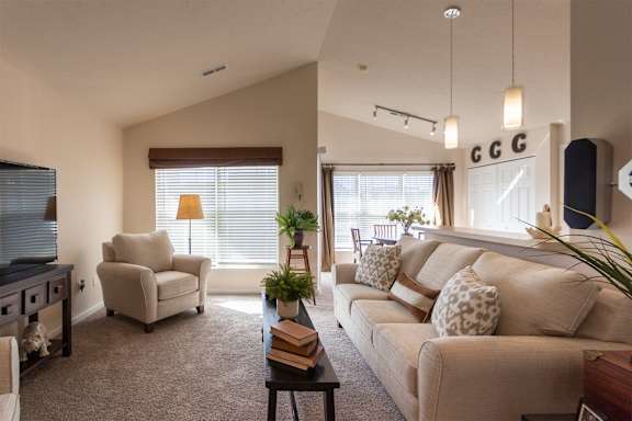 This is a photo of the living room in the 1016 square foot, 2 bedroom, 2 bath Nautica floor plan at Nantucket Apartments in Loveland, OH.