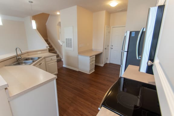 This is a photo of the kitchen in the 1578 square foot, 3 bedroom Flagship floor plan at Nantucket Apartments in Loveland, OH.