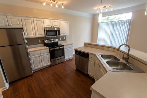 This is a photo of the kitchen in the 1578 square foot, 3 bedroom Flagship floor plan at Nantucket Apartments in Loveland, OH.