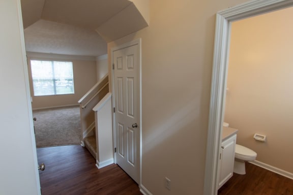 This is a photo of the entryway and half bath in the 1578 square foot, 3 bedroom, 2 and 1/2 bath Flagship floor plan at Nantucket Apartments in Loveland, OH.