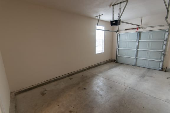 This is a photo of the attached single car garage in the 1578 square foot, 3 bedroom, 2 and 1/2 bath Flagship floor plan at Nantucket Apartments in Loveland, OH.