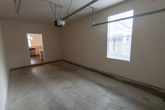 This is a photo of the attached single car garage in the 1578 square foot, 3 bedroom, 2 and 1/2 bath Flagship floor plan at Nantucket Apartments in Loveland, OH.
