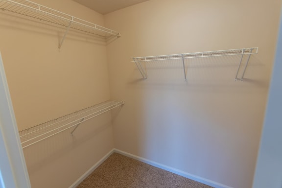 This is a photo of the second bedroom walk-in closet in the 1578 square foot, 3 bedroom, 2 and 1/2 bath Flagship floor plan at Nantucket Apartments in Loveland, OH.
