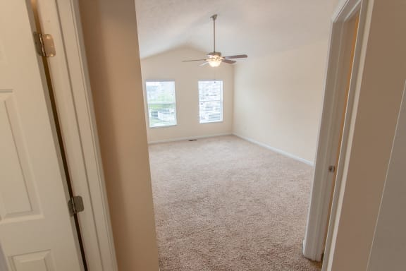 This is a photo of the primary bedroom in the 1578 square foot, 3 bedroom, 2 and 1/2 bath Flagship floor plan at Nantucket Apartments in Loveland, OH.