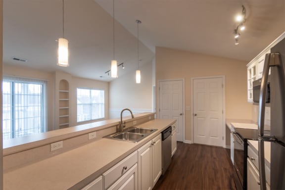 This is a photo of the kitchen in the 2 bedroom, 2 bath Islander floor plan with vaulted ceilings at Nantucket Apartments in Loveland, OH.