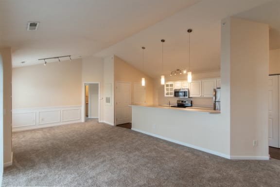 This is a photo of the living room in the 2 bedroom, 2 bath Islander floor plan with vaulted ceilings at Nantucket Apartments in Loveland, OH.