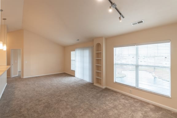 This is a photo of the living room in the 2 bedroom, 2 bath Islander floor plan with vaulted ceilings at Nantucket Apartments in Loveland, OH.