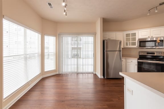 This is a photo of the dining room and kitchen in the 1255 square foot, 2 bedroom, 2 bath LIghthouse floor plan at Nantucket Apartments in Loveland, OH.