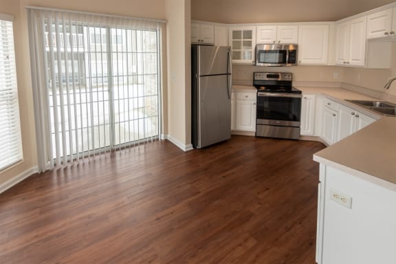This is a photo of the dining room and kitchen in the 1255 square foot, 2 bedroom, 2 bath LIghthouse floor plan at Nantucket Apartments in Loveland, OH.