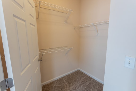 This is a photo of the primary bedroom walk-in closet in the 1255 square foot, 2 bedroom, 2 bath LIghthouse floor plan at Nantucket Apartments in Loveland, OH.