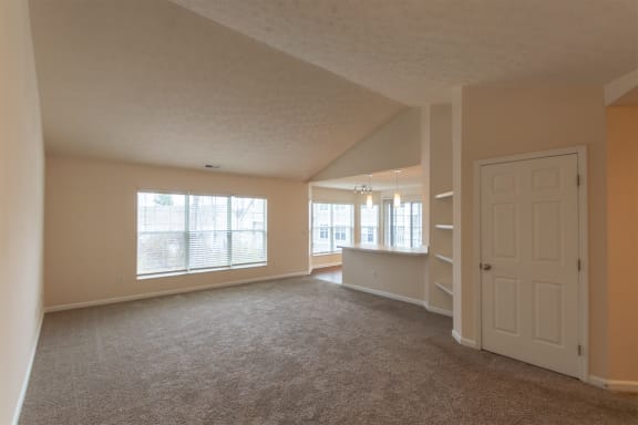 This is a photo of the living room in the 1255 square foot, 2 bedroom, 2 bath Lighthouse floor plan with vaulted ceilings at Nantucket Apartments in Loveland, OH.