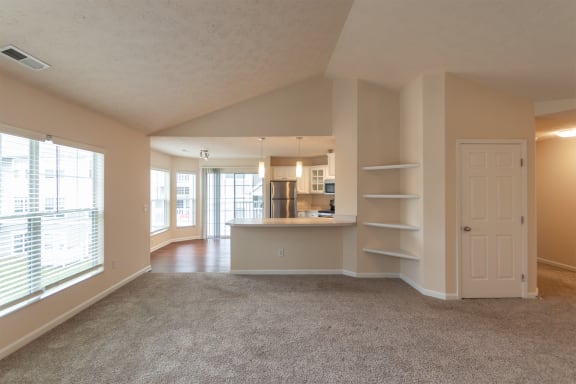 This is a photo of the living room in the 1255 square foot, 2 bedroom, 2 bath Lighthouse floor plan with vaulted ceilings at Nantucket Apartments in Loveland, OH.