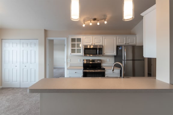 This is a photo of the kitchen in the 1016 square foot, 2 bedroom, 2 bath Nautica floor plan with vaulted ceilings at Nantucket Apartments in Loveland, OH.