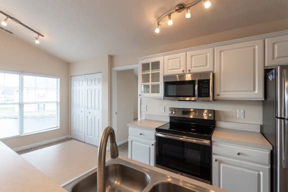 This is a photo of the kitchen in the 1016 square foot, 2 bedroom, 2 bath Nautica floor plan with vaulted ceilings at Nantucket Apartments in Loveland, OH.