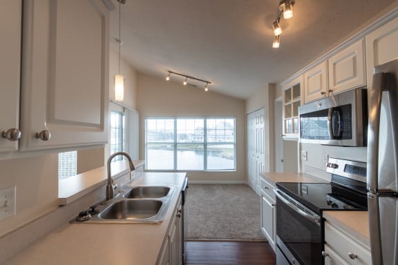 This is a photo of the kitchen in the 1016 square foot, 2 bedroom, 2 bath Nautica floor plan with vaulted ceilings at Nantucket Apartments in Loveland, OH.