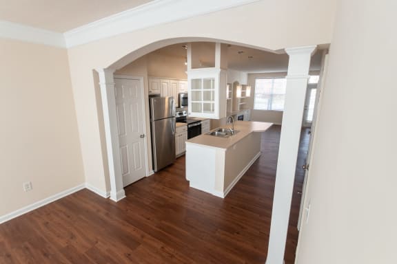 This is a photo of the kitchen from the dining room in the 1498 square foot, 2 bedroom, 2 and 1/2 bath Schooner floor plan at Nantucket Apartments in Loveland, OH.