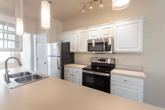 This is a photo of the kitchen in the 1498 square foot, 2 bedroom, 2 and 1/2 bath Schooner floor plan at Nantucket Apartments in Loveland, OH.