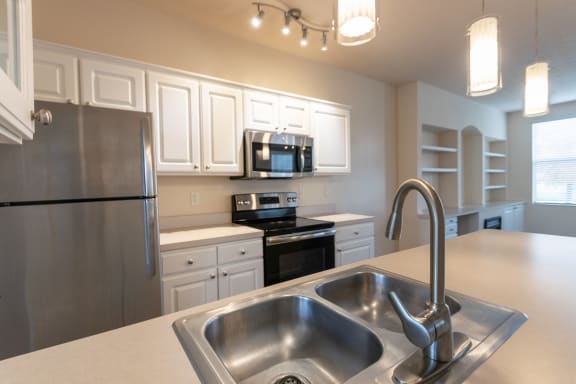 This is a photo of the kitchen in the 1498 square foot, 2 bedroom, 2 and 1/2 bath Schooner floor plan at Nantucket Apartments in Loveland, OH.