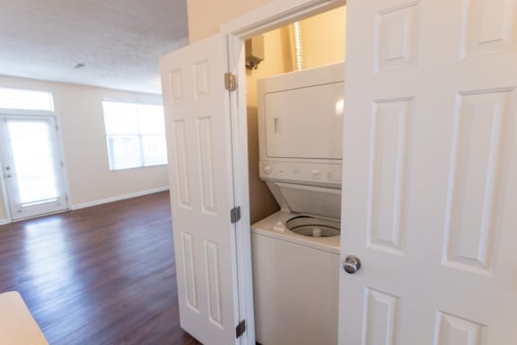 This is a photo of the stackable washer and dryer in the utility closet in the 1498 square foot, 2 bedroom, 2 and 1/2 bath Schooner floor plan at Nantucket Apartments in Loveland, OH.