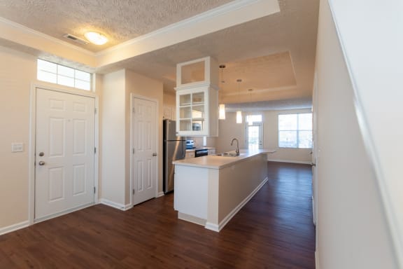 This is a photo of the entryway and kitchen in the 1389 square foot, 2 bedroom, 2 and a 1/2 bath Yachtsman floor plan at Nantucket Apartments in Loveland, OH.