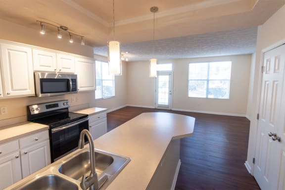 This is a photo of the living room from the kitchen in the 1389 square foot, 2 bedroom, 2 and a 1/2 bath Yachtsman floor plan at Nantucket Apartments in Loveland, OH.