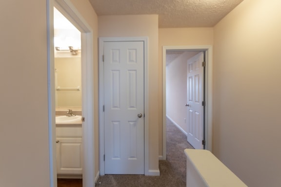 This is a photo of the second floor hallway in the 1389 square foot, 2 bedroom, 2 and a 1/2 bath Yachtsman floor plan at Nantucket Apartments in Loveland, OH.