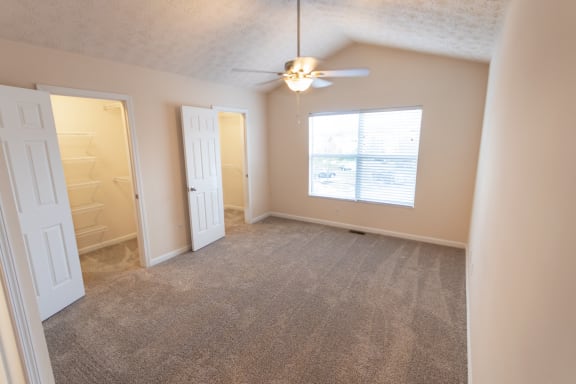 This is a photo of the primary bedroom in the 1389 square foot, 2 bedroom, 2 and a 1/2 bath Yachtsman floor plan at Nantucket Apartments in Loveland, OH.