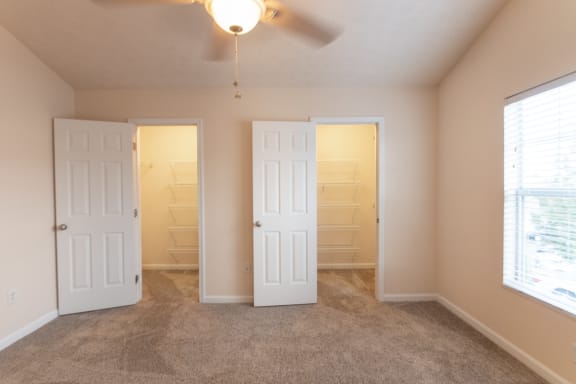 This is a photo of the primary bedroom in the 1389 square foot, 2 bedroom, 2 and a 1/2 bath Yachtsman floor plan at Nantucket Apartments in Loveland, OH.
