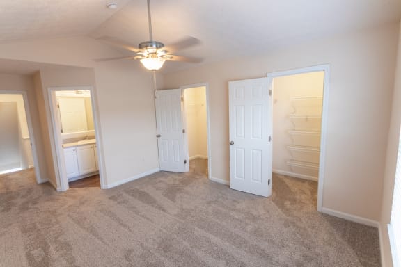 This is a photo of the primary bedroom in the 1389 square foot, 2 bedroom, 2 and a 1/2 bath Yachtsman floor plan at Nantucket Apartments in Loveland, OH.