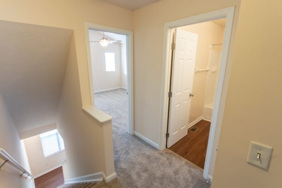This is a photo of the second floor hallway in the 1389 square foot, 2 bedroom, 2 and a 1/2 bath Yachtsman floor plan at Nantucket Apartments in Loveland, OH.