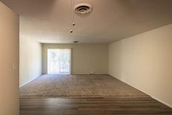 View of the living room from dinng area of the 1100 square foot, 3 bedroom, 2 bath floor plan at Park Lane Apartments in Paddock Hills, Cincinnati, OH (Victory Pkwy).