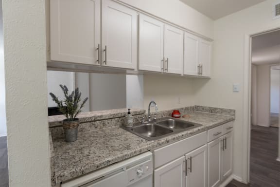 This is a photo of the kitchen in the 970 square foot 2 bedroom, 2 bath apartment at Preston Park Apartments in Dallas, TX