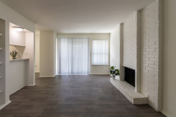 This is a photo of the living room in the 970 square foot 2 bedroom, 2 bath apartment at Preston Park Apartments in Dallas, TX