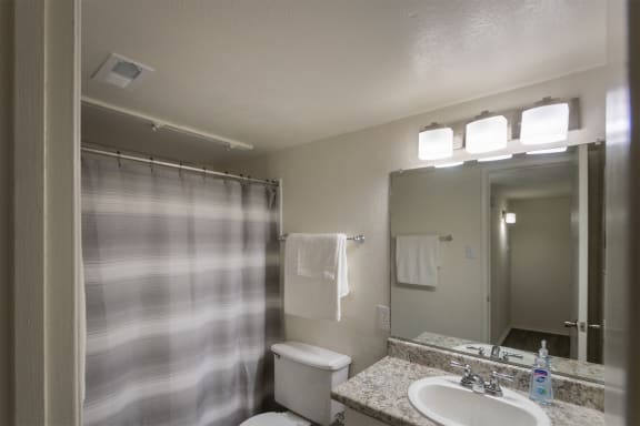 This is a photo of the bathroom in the 970 square foot 2 bedroom, 2 bath apartment at Preston Park Apartments in Dallas, TX