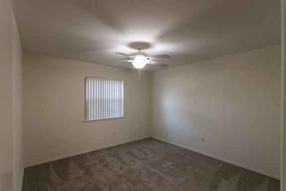 This is a photo of the primary bedroom in the 970 square foot 2 bedroom, 2 bath apartment at Preston Park Apartments in Dallas, TX