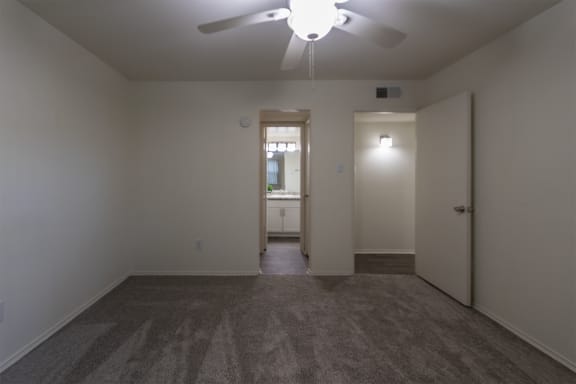 This is a photo of the primary bedroom in the 970 square foot 2 bedroom, 2 bath apartment at Preston Park Apartments in Dallas, TX